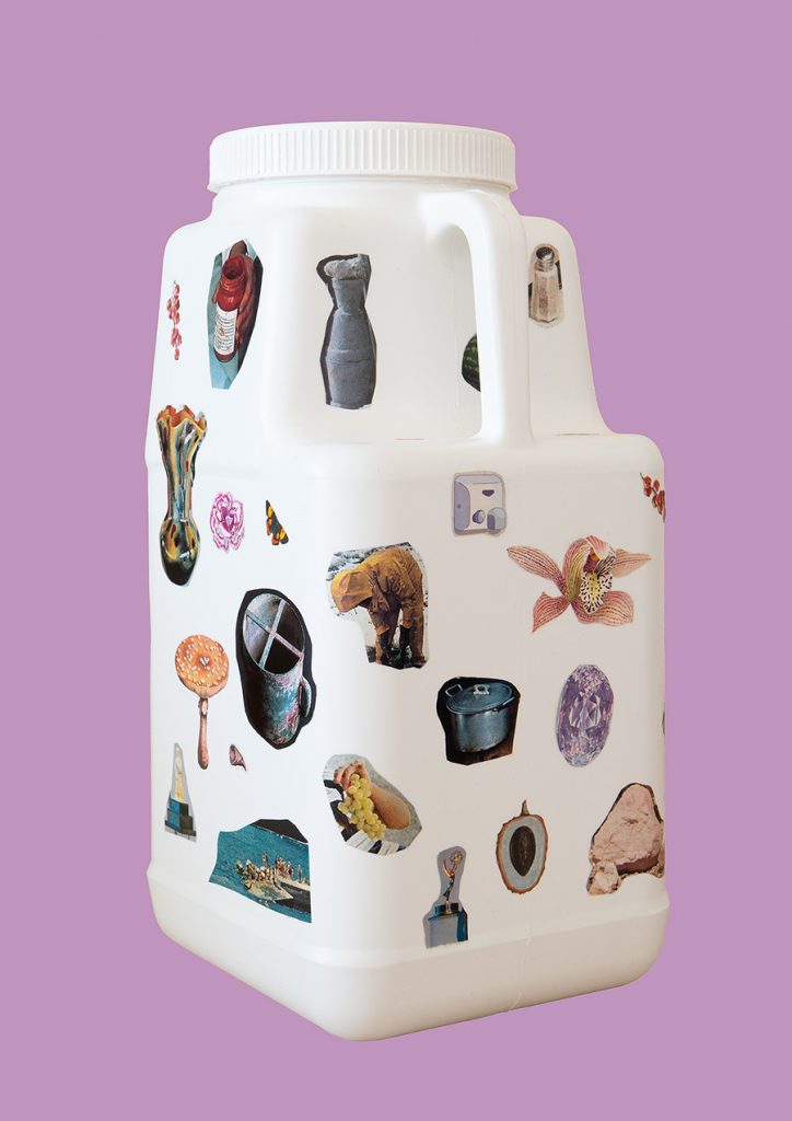 A white laundry container collaged with bits cut form a magazine